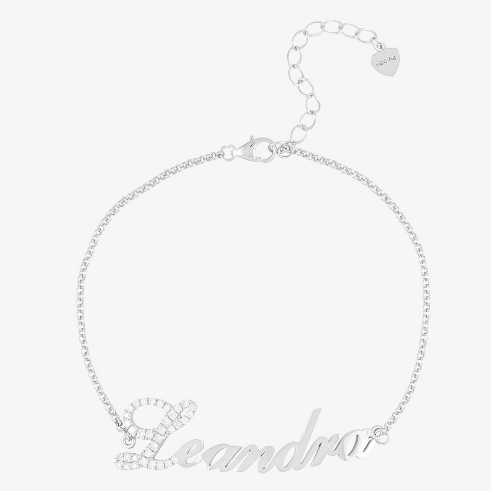 Sterling silver name bracelet with crystal-embellished "L" on delicate chain.