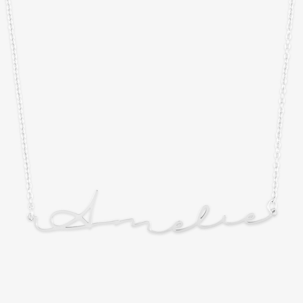 Sterling silver necklace with "Amelie" in elegant signature script font. Unique name jewelry for everyday wear.