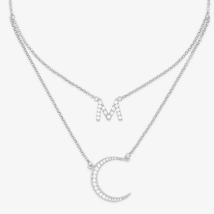 Customizable crescent moon initial necklace in 925 sterling silver with letter M pendant, embodying elegance and celestial beauty.