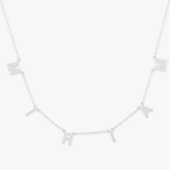 Personalized elegant block letter necklace in sterling silver spelling "MIRIAM" with adjustable chain length.