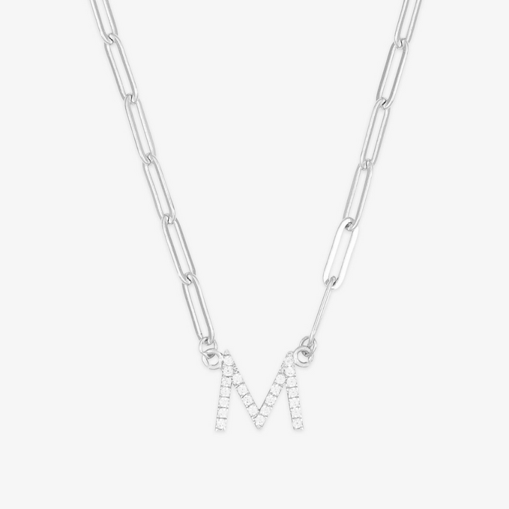 Silver crystal linkchain initial necklace with the letter 'M,' sparkling elegantly on a sleek chain.