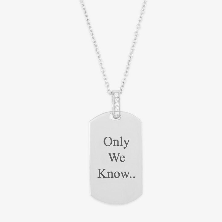 Personalized engraved necklace with "Only We Know" inscription on a silver pendant.