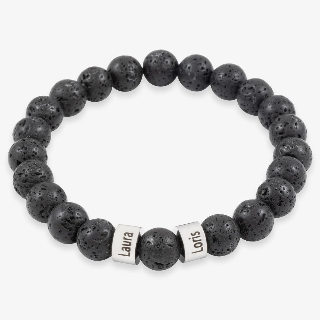 Black beaded bracelet with two engravable stainless steel rings on white background