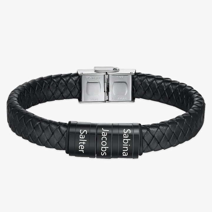 Customizable men's leather bracelet with three engraved black stainless steel rings on a black faux leather strap with silver clasp.