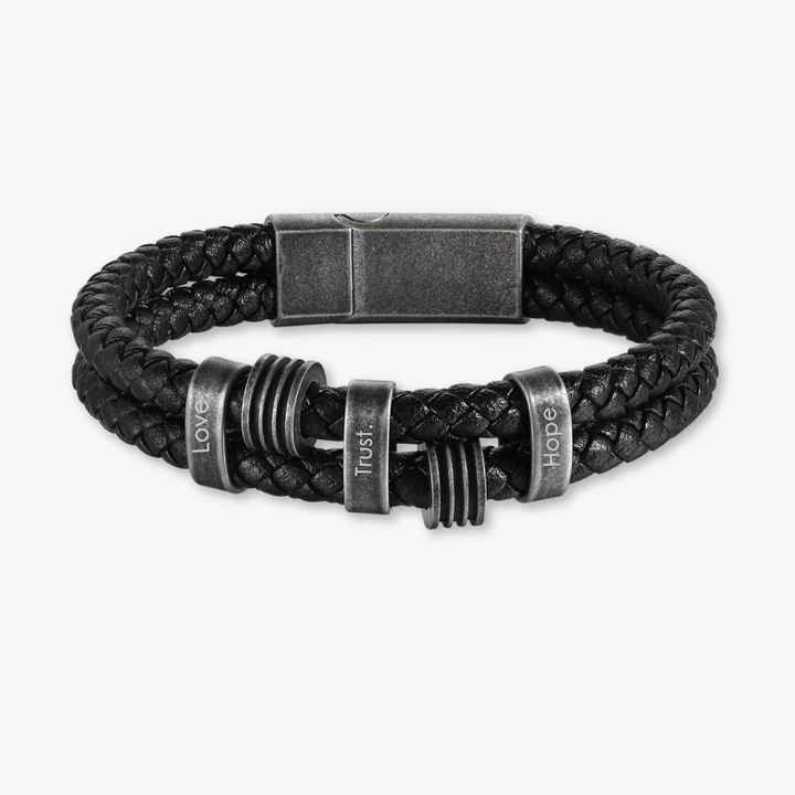 Personalized black braided leather bracelet with dark grey stainless steel rings and custom engravings options.