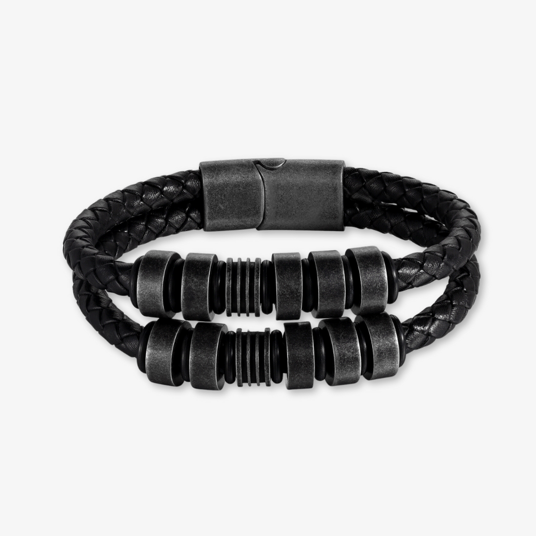 Black braided leather bracelet with stainless steel accents offering ten custom engraving options for personalized style.