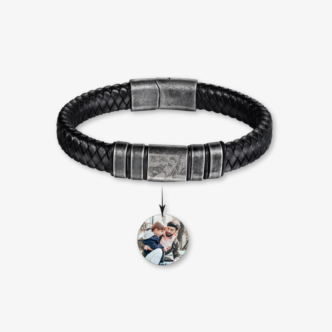 Black leather bracelet with four text engravings and a photo personalization creating a unique accessory. Stainless steel clasp.