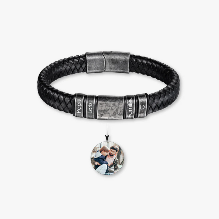 Personalized black leather bracelet with four engravings and a central photo, featuring stainless steel details.