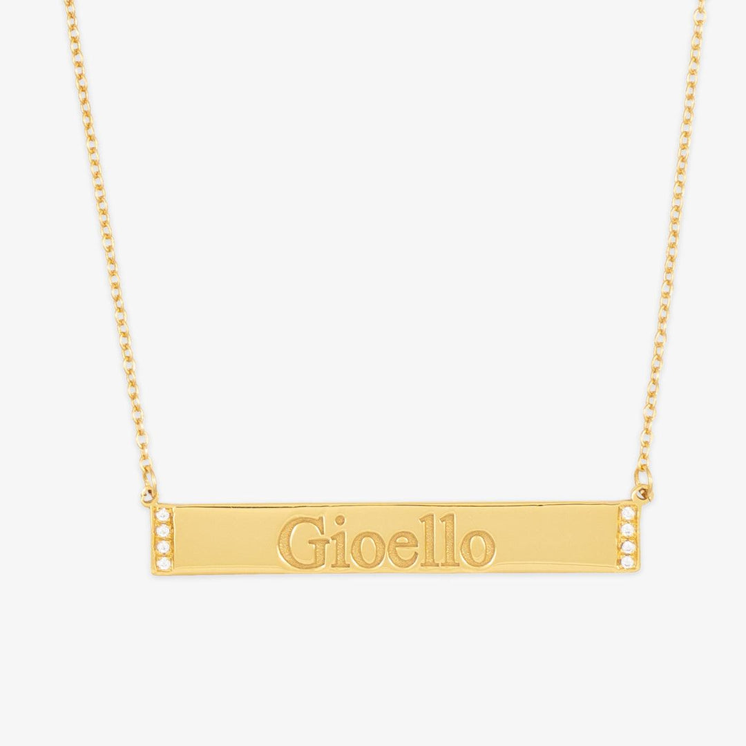 Crystal-edged bar engraved necklace with "Gioello" inscription, showcasing elegance and personalization potential.