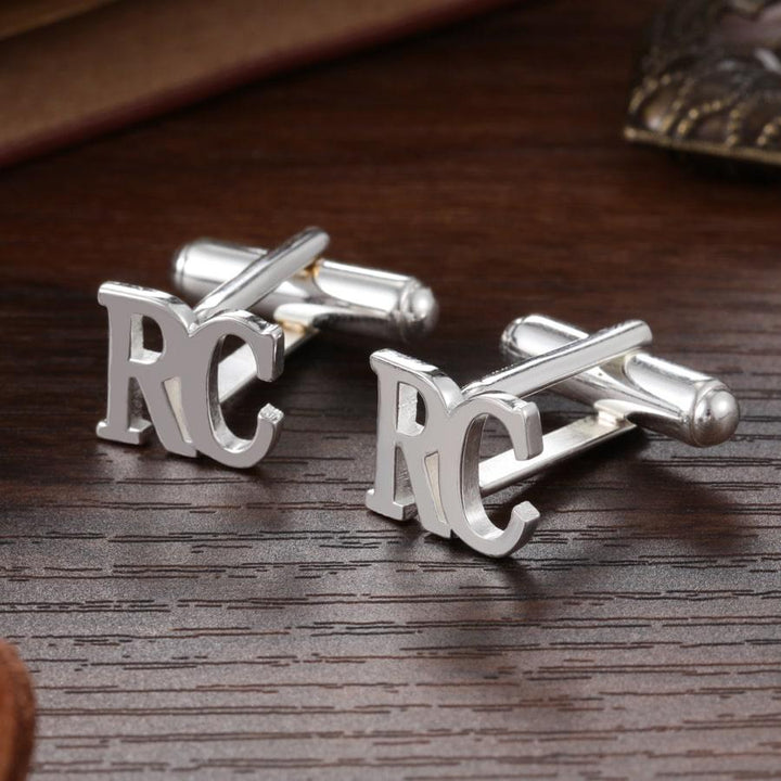 Personalized sterling silver cufflinks with engraved initials in classic Times New Roman font, perfect for adding elegance to any outfit.