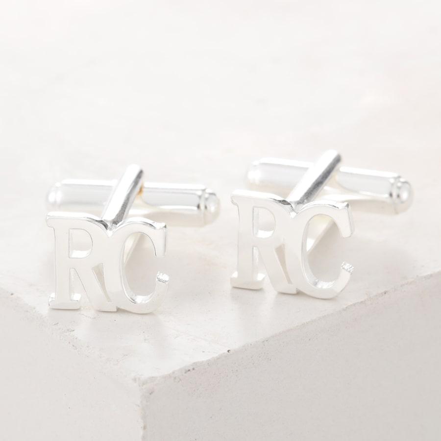 Personalized sterling silver cufflinks with initials "RC" engraved in Times New Roman font, perfect for business meetings and special events.