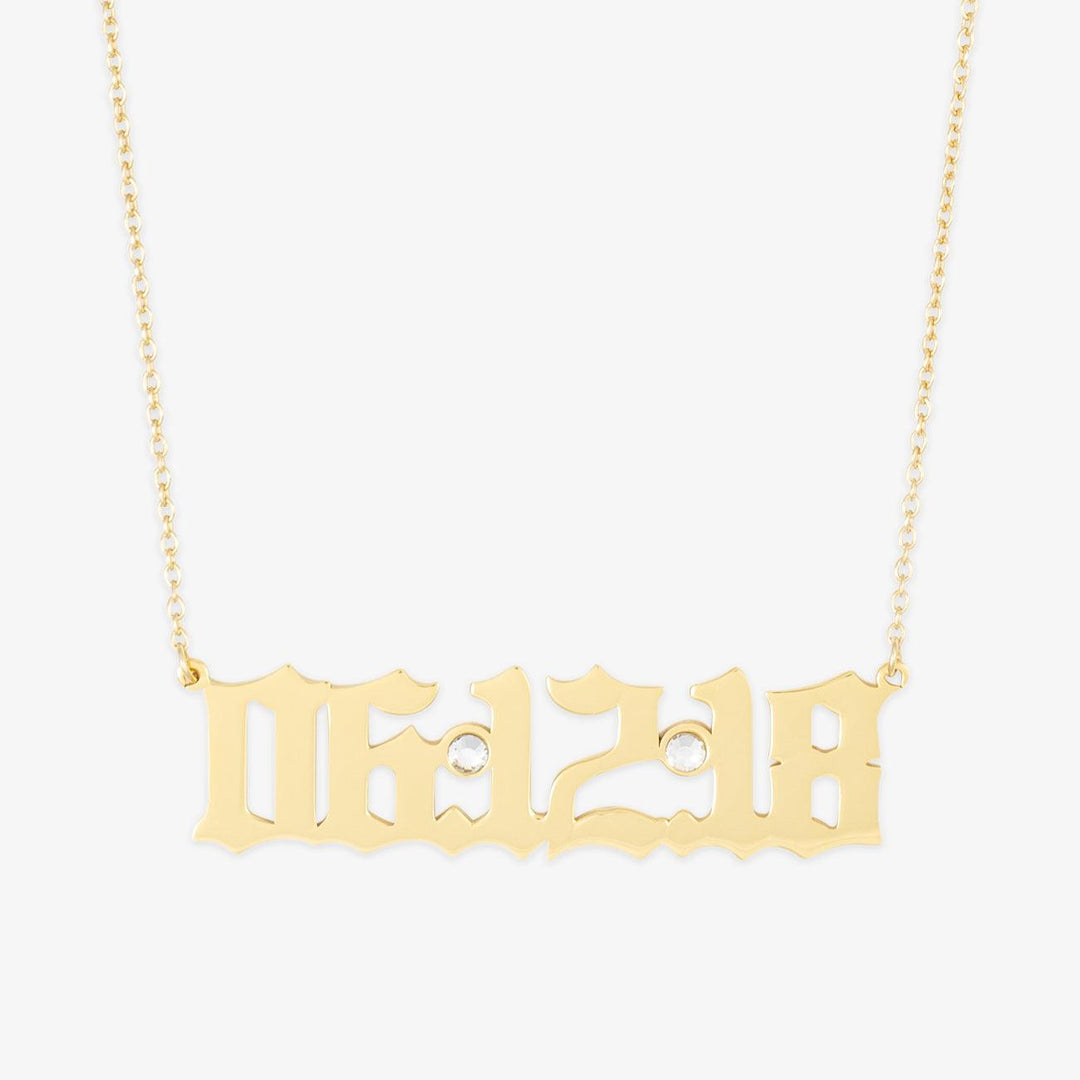 Gold date necklace with zirconia crystals displaying the date 06.12.18 on a delicate chain.