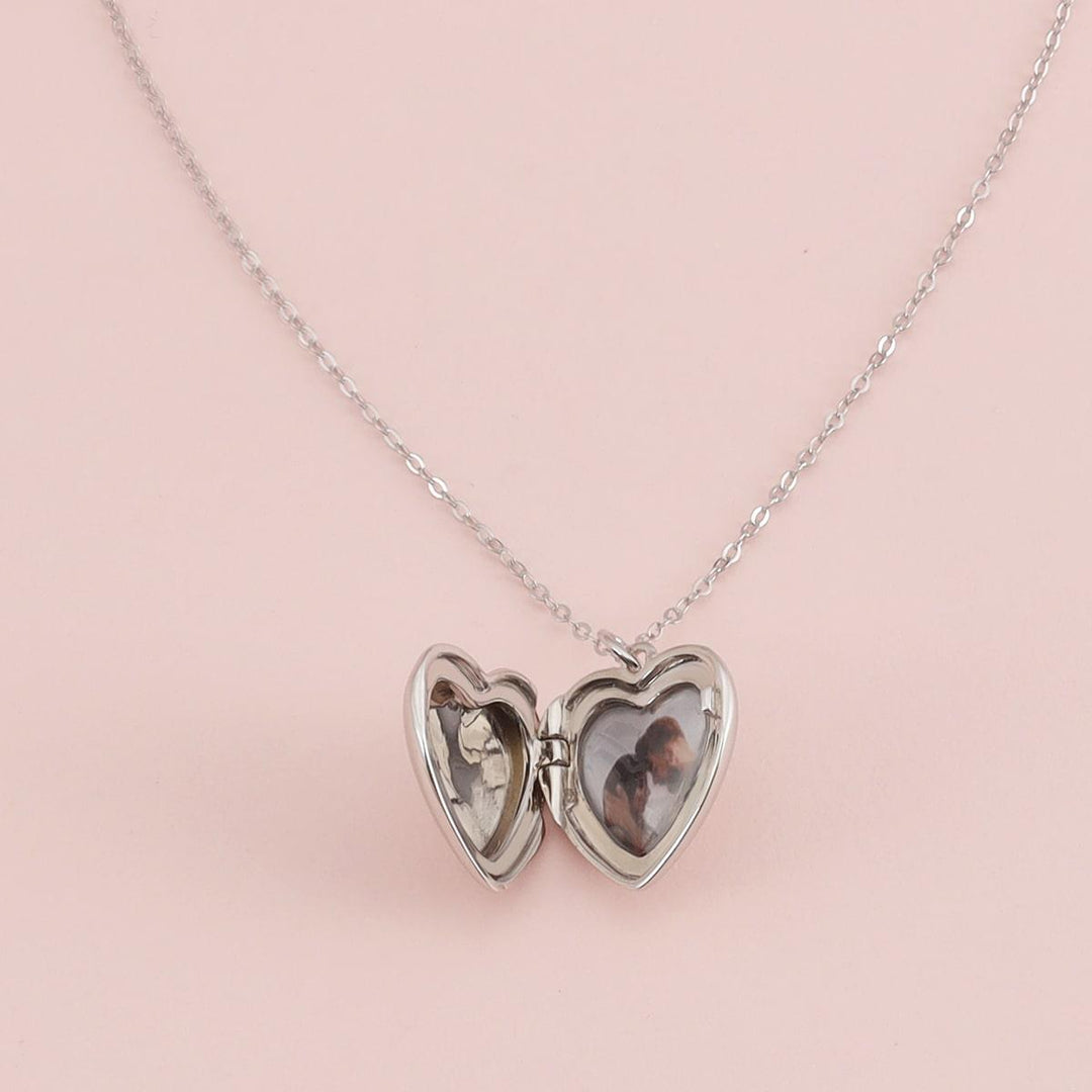 Personalized heart photo locket necklace in 925 sterling silver with space for photos and engraving, perfect for keeping memories close.