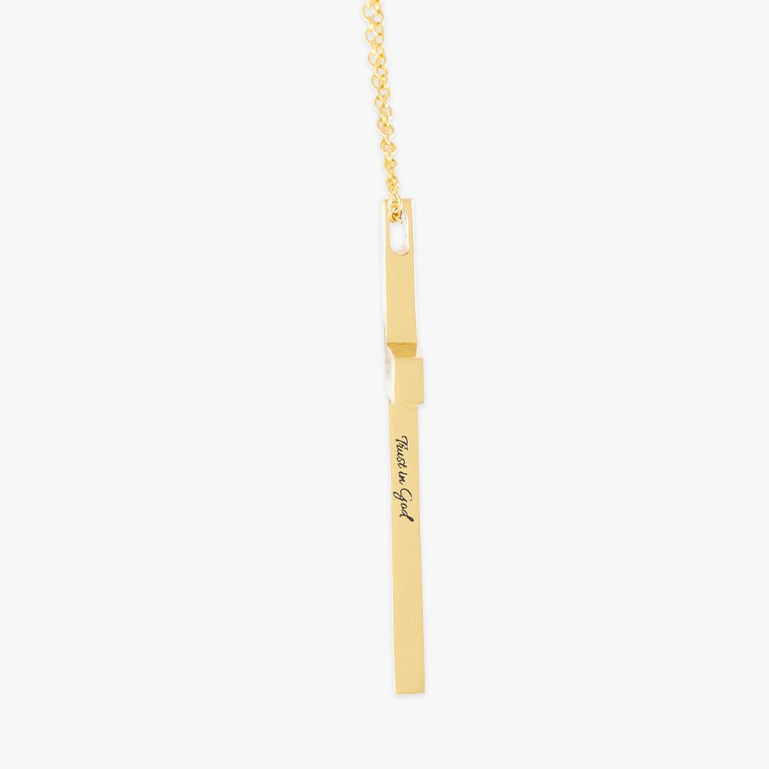 Personalized side-engraved gold cross necklace with delicate chain, crafted from high-quality materials for a meaningful touch.