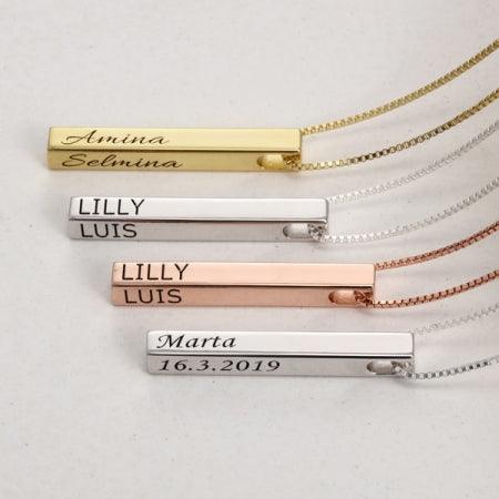 Quad-Engrave Sterling Bar Necklaces with personalized engravings in gold, silver, and rose gold on a display.