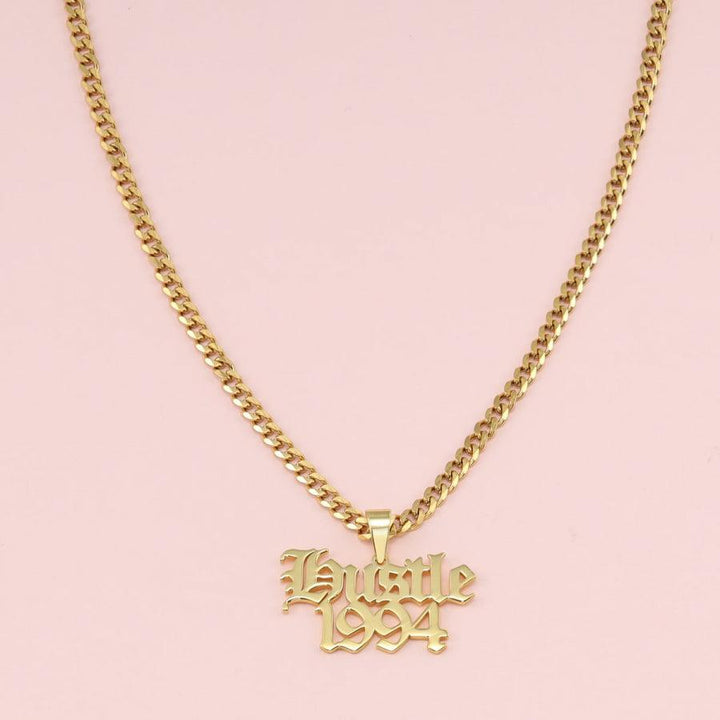 Men's streetwear style custom name necklace with gold chain and "Hustle 1994" pendant