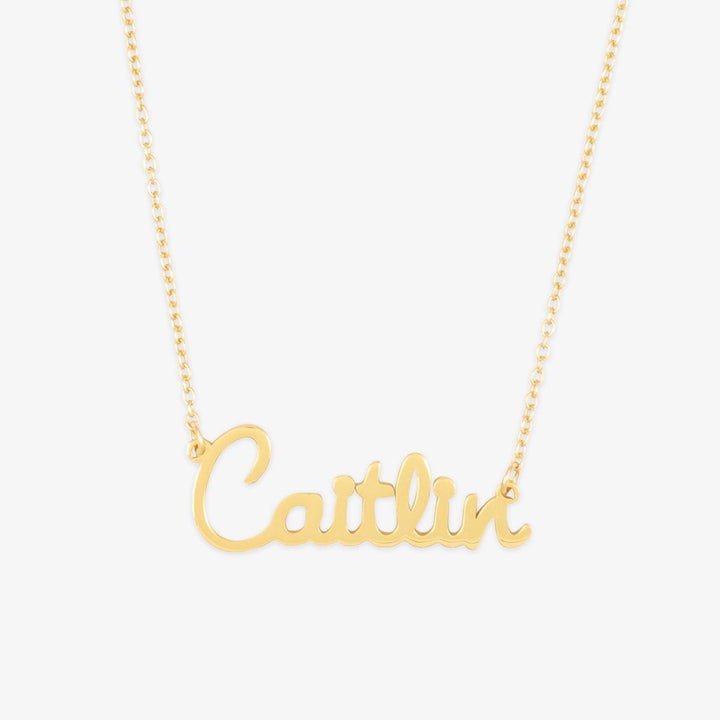 Elegant cursive name necklace "Caitlin" in gold, playful tenderness, and elegant script jewelry, perfect for everyday and special occasions.