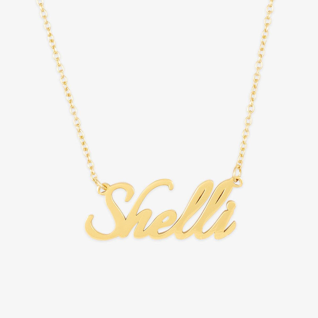 Shelli Style Name Necklace in gold with script font and elongated italic design