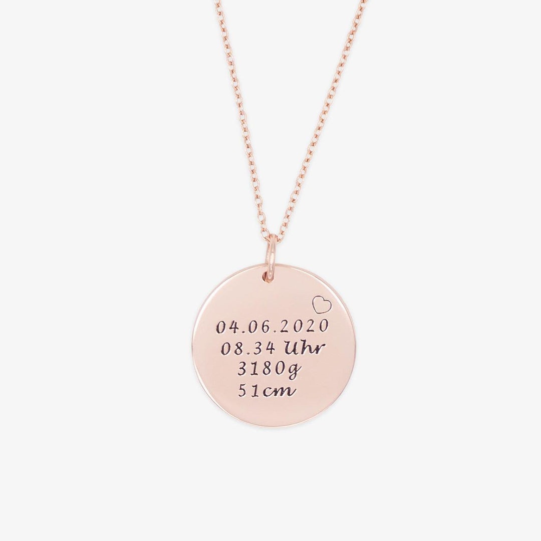 Personalizable newborn birth date necklace in rose gold with engraved birth details on a round locket pendant made from 925 Sterling Silver.