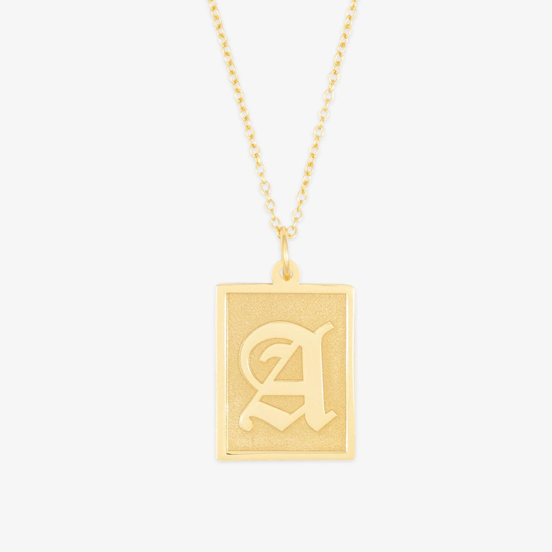 Gold Old English initial necklace with rectangular plate pendant featuring the letter 'A'. Classic design available in silver and rosegold.