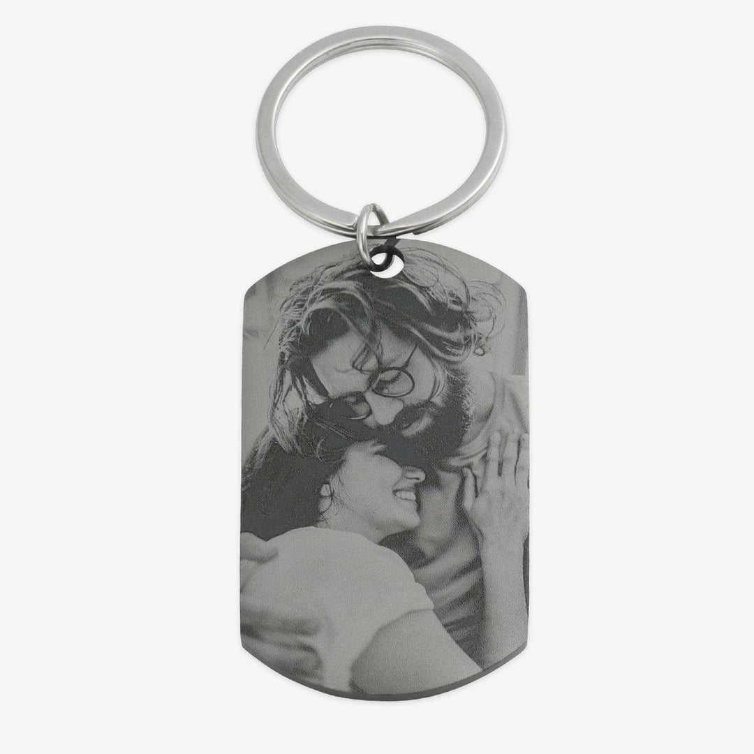 Personalized black photo keychain with custom engraving, featuring a couple's photo on high-quality stainless steel pendant.