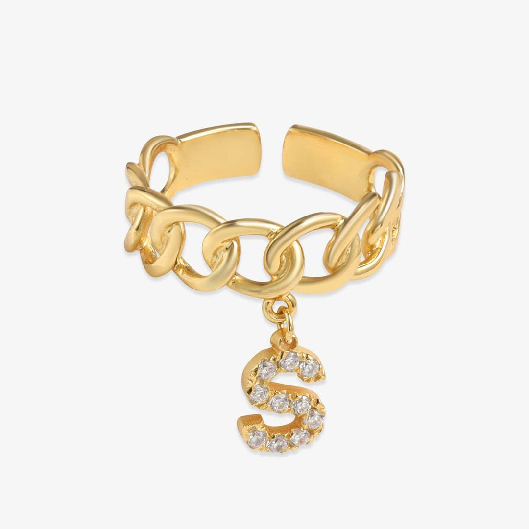 Personalized gold curb chain ring with hanging initial letter "S", adorned with sparkling stones, made of high-quality 925 sterling silver.