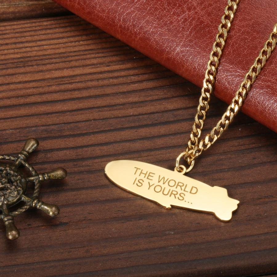 Personalized Zeppelin Pendant Necklace with 18K gold plating, engraved with "The World is Yours" on a wide curb chain. Inspired by "Scarface"