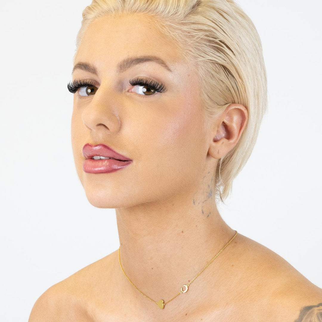 Model wearing Sideways Letter Necklace in 925 Sterling Silver with gold plating