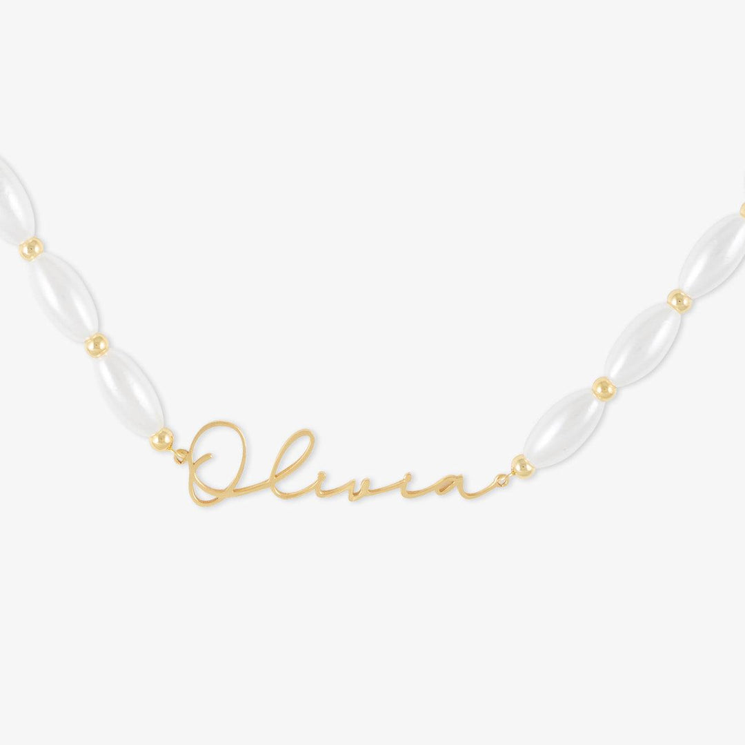 Customizable pearl name necklace with Signature Script and oval pearls in high-quality 925 Sterling Silver.